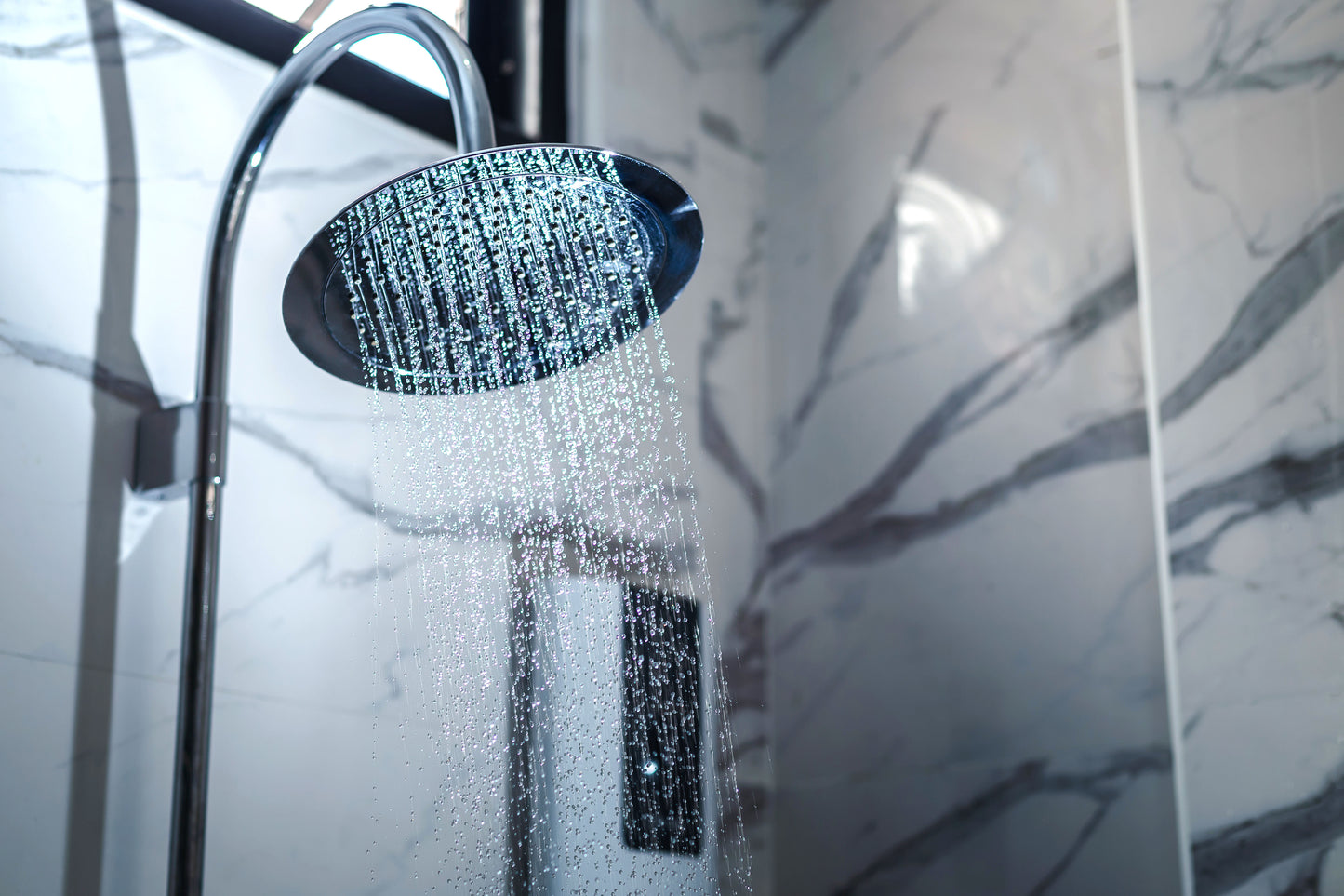 High pressure shower head water drops close-up